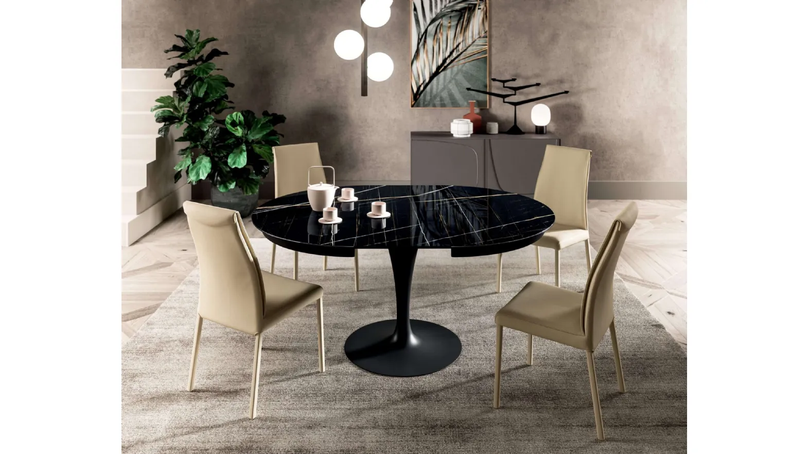 Tavolo rotondo allungabile Eclipse con top in marble glass Sahara Noir Lucido e base in metallo di Ozzio